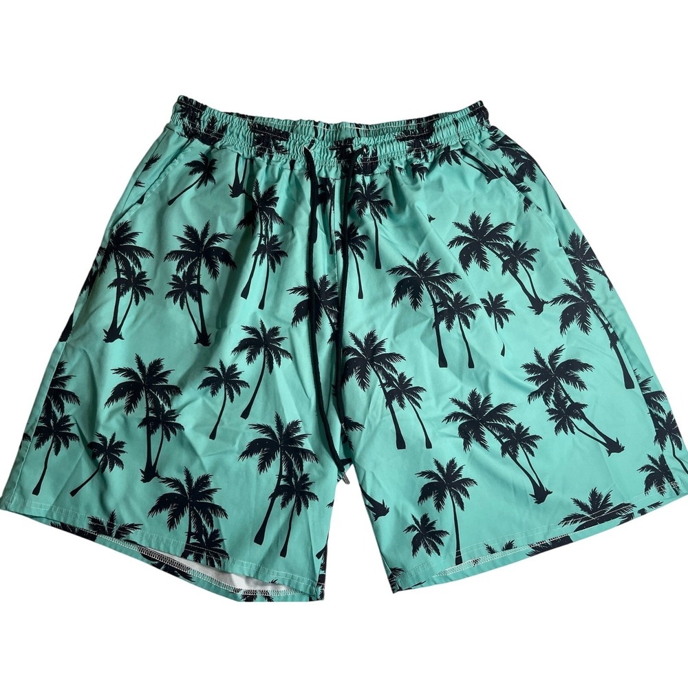 Vibrant green color covered in black palm tree pattern swim trunks-used